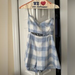 Lovers + Friends Gingham Romper with a Tie in back. Size: Small.